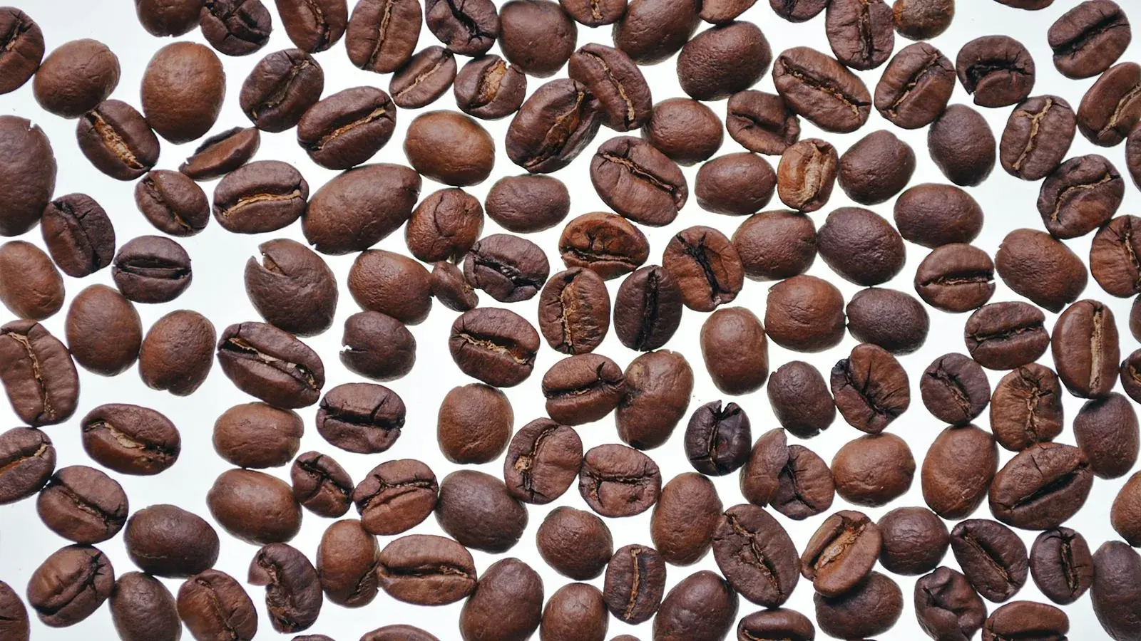 Photo by Irina P on Pexels Roasted coffee beans on a white surface