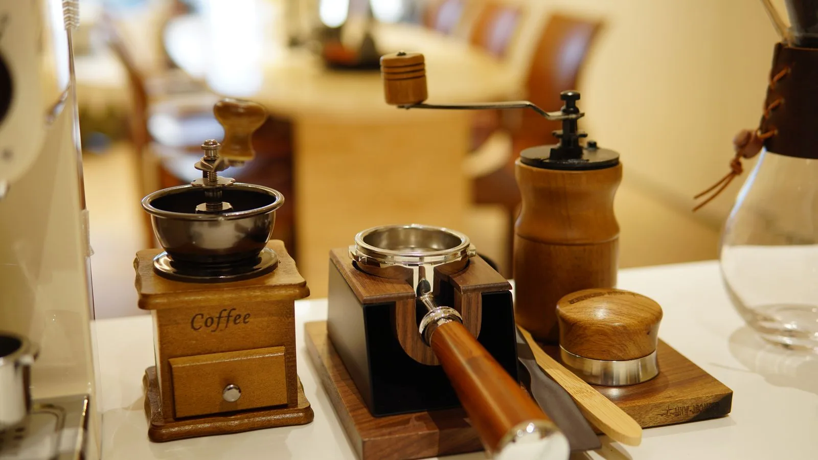 Manual coffee grinders and preparation tools