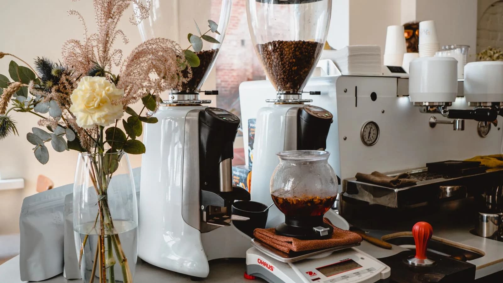 Photo by Arti Kh on Pexels Coffee grinders and brewing equipment on a café counter