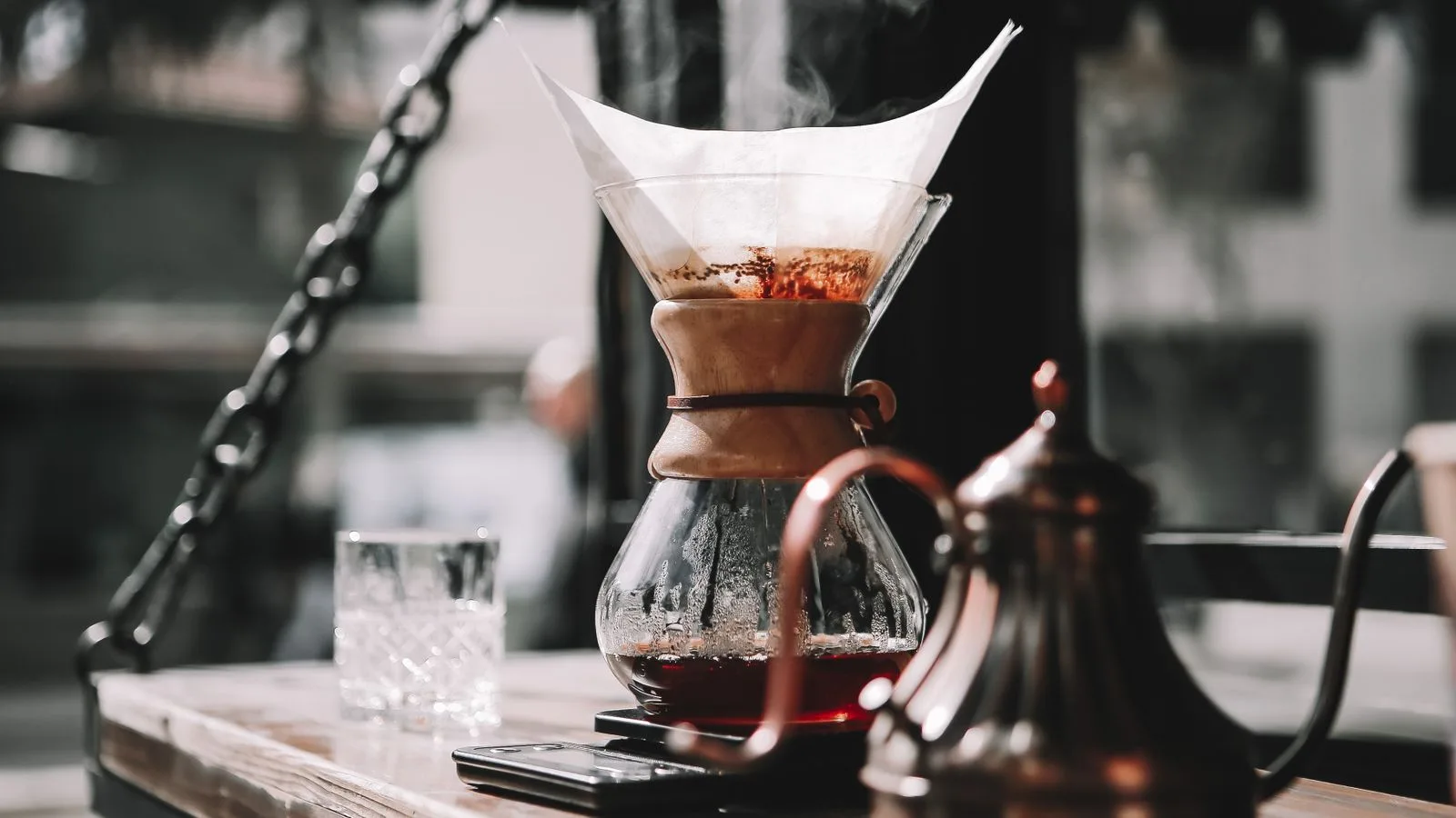Hot water poured over ground coffee in a paper filter