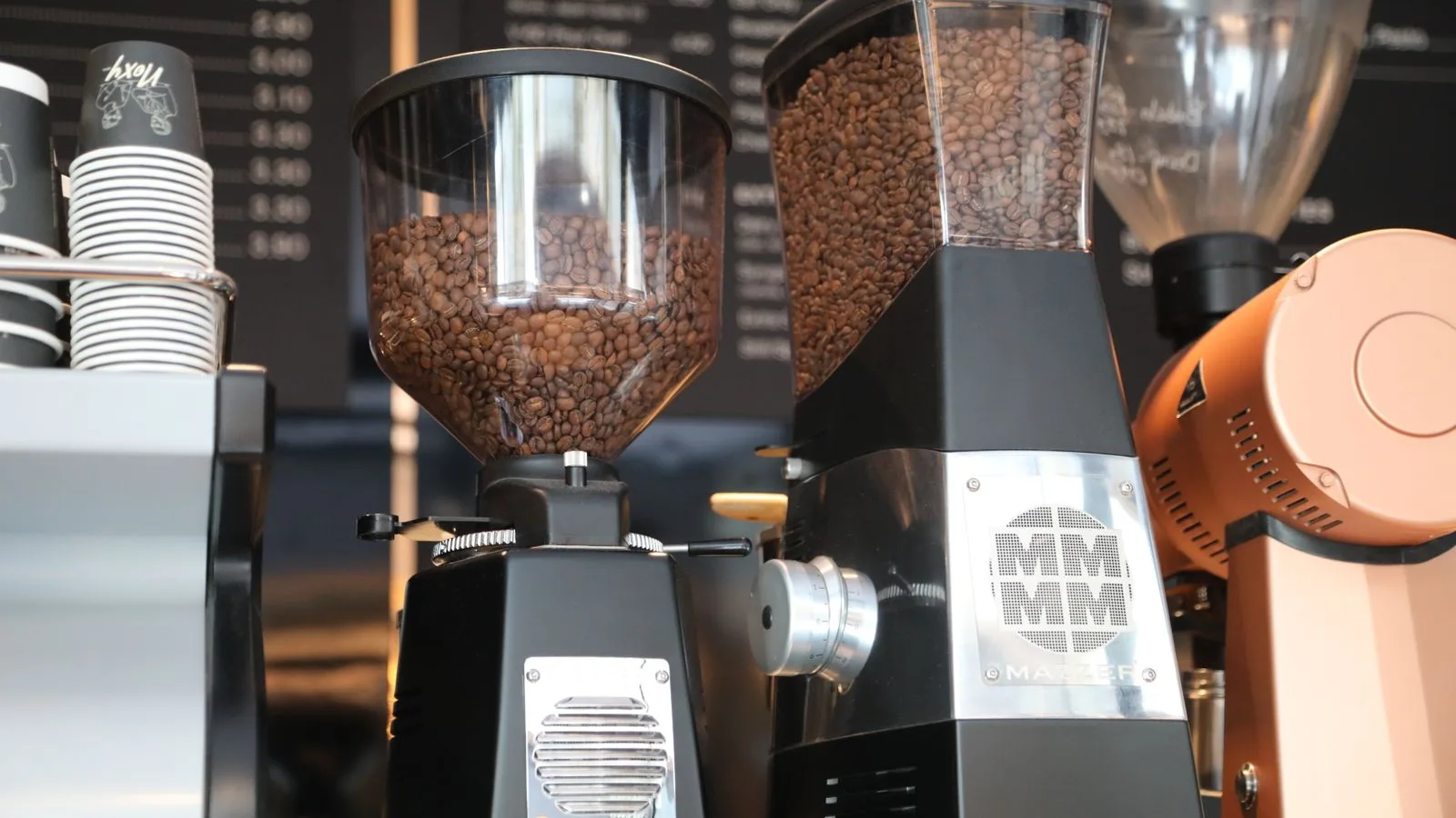 Coffee grinders on a café counter